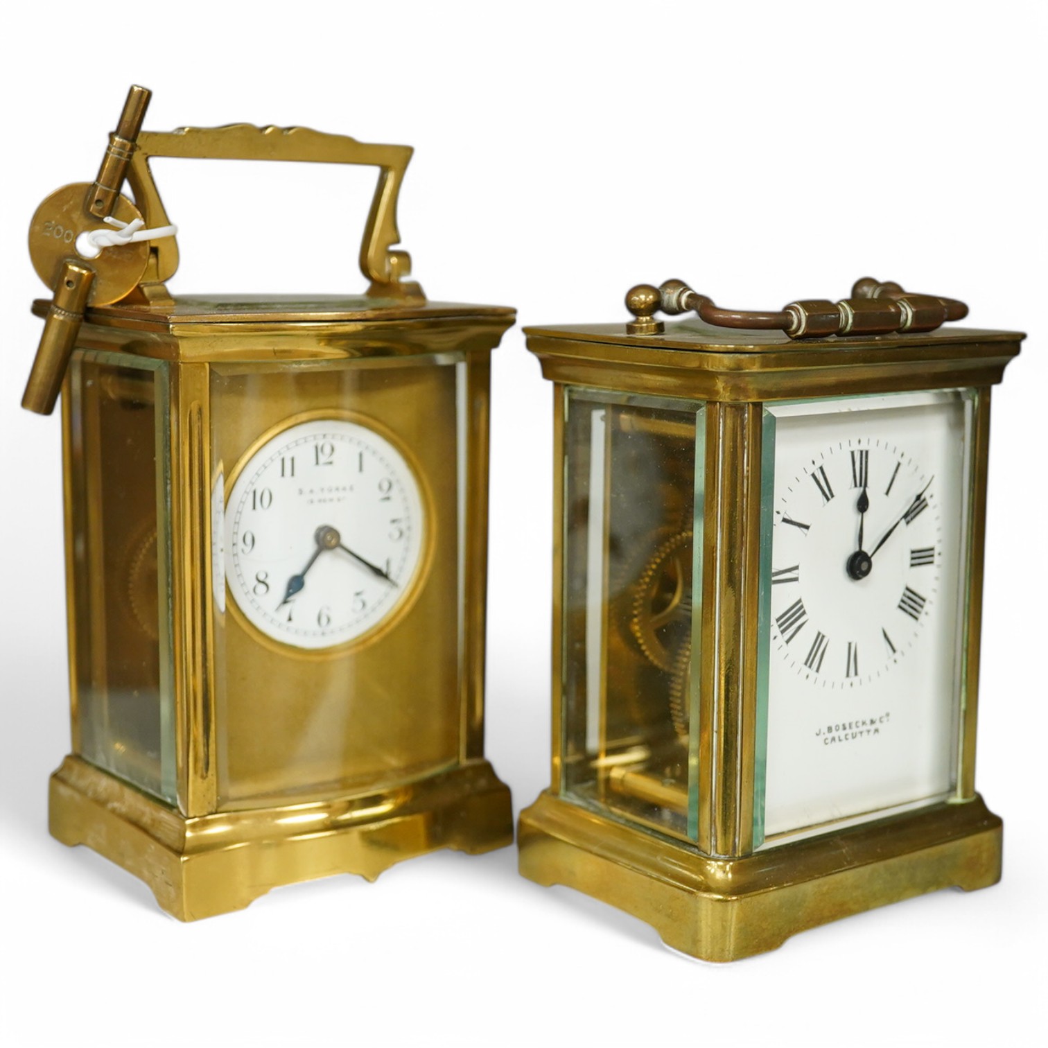 Two brass cased carriage timepieces, tallest 11cm. Condition - fair to good.